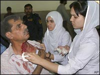 An injured man receives treatment at a local hospital in Lahore, Pakistan, May 27